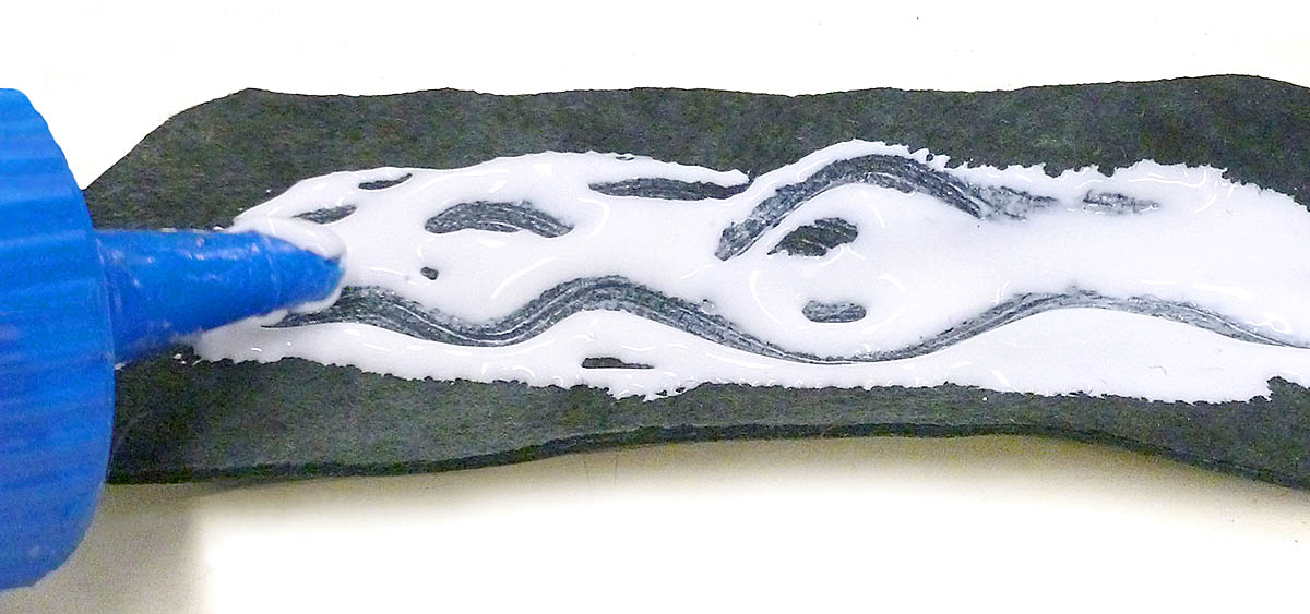 Leather adhesive is applied to the scrap backing